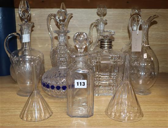 A collection of decanters, ewers and funnels